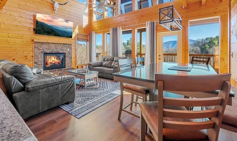 The living room features a gas fire place and views for days!