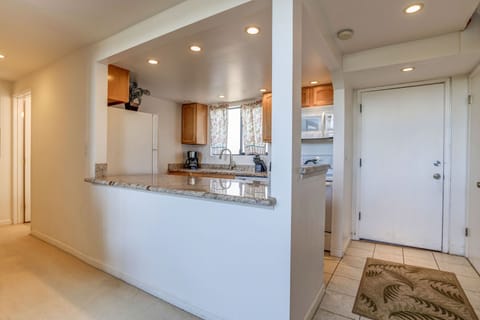 Kitchen has an open layout. Downstairs bathroom located at the end of the hallway.