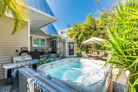 Indulge in the luxury of a private hot tub, the perfect spot to unwind while your meal sizzles on the grill