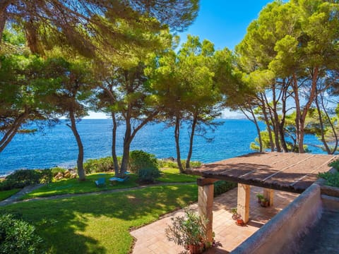 Water, Plant, Sky, Property, Building, Shade, Natural Landscape, House, Tree, Outdoor Furniture