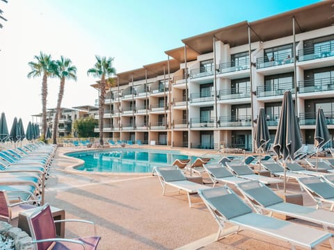 Sky, Building, Property, Azure, Swimming Pool, Urban Design, Outdoor Furniture, Tree, Sunlounger, Condominium