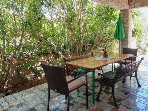 Furniture, Table, Plant, Chair, Green, Wood, Building, Outdoor Furniture, Shade, Outdoor Table