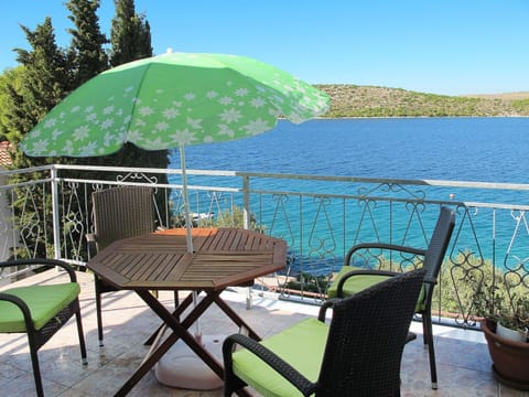 Water, Sky, Plant, Furniture, Property, Table, Green, Umbrella, Azure, Shade