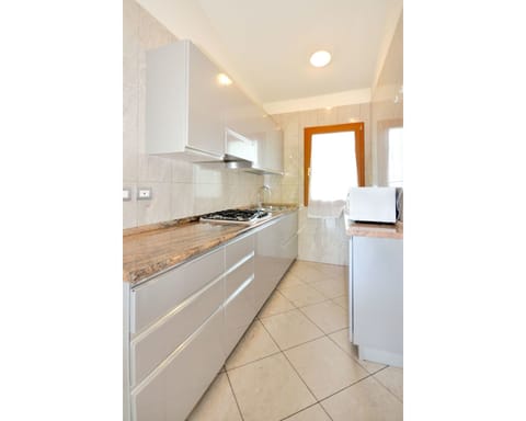 Property, Room, Countertop, Cabinetry, Furniture, Kitchen, Tile, Interior Design, Floor, Building