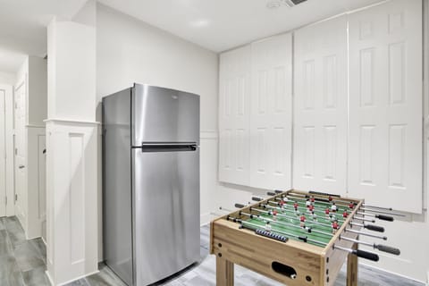 Extra fridge and foosball table