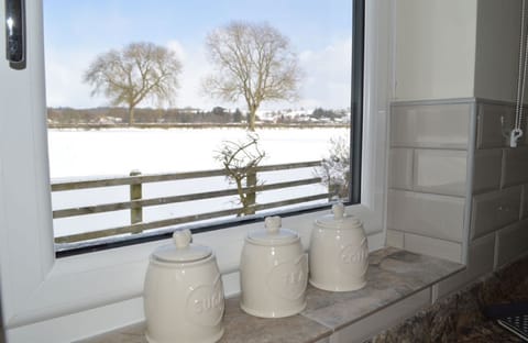 A view from the kitchen to open countryside