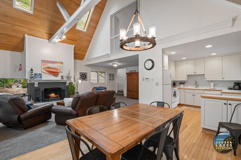 Open concept dining to living room. Living room has smart TV and fireplace