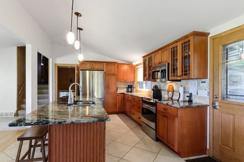 Fully equipped kitchen with electric stove, drip coffee maker