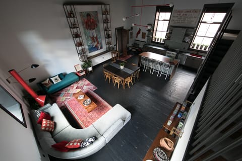 Shot of living, dining, and kitchen from mezzanine