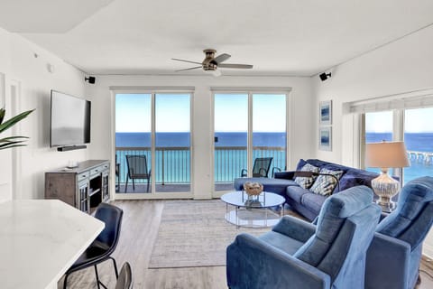 Relax in your oceanfront living room where panoramic windows frame endless sea views and coastal breezes flow through your private balcony.