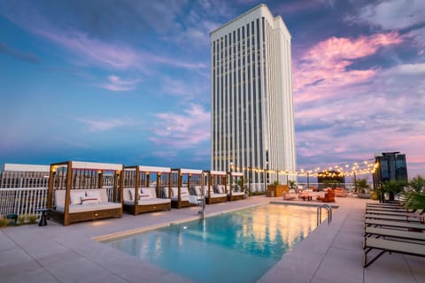 Seasonal outdoor pool, open 9:00 AM to 7:00 PM, sun loungers