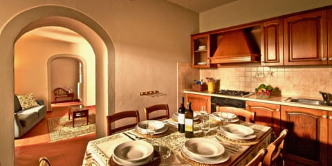 Fully equipped kitchen with 4 ring gas hob, oven, fridge freezer, table & chairs