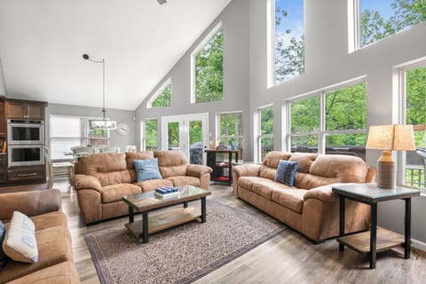 Great room with 3 couches and Smart TV