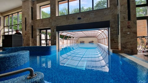 Indoor pool, outdoor pool, open 8:00 AM to 8:00 PM, pool umbrellas