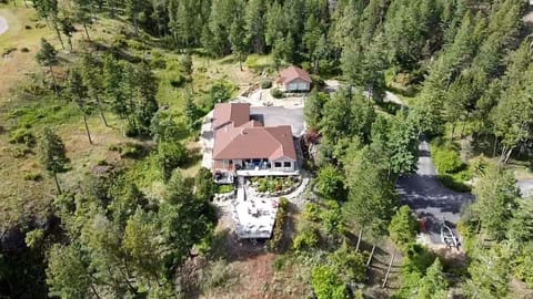 Drone view of our home and cottage rental in the background.