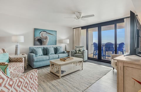 Living area with queen sleeper sofa and Smart TV at Orange Beach Wind Drift