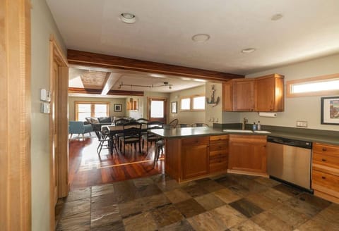 The view from the kitchen looking into the dinning and living room spaces. 
