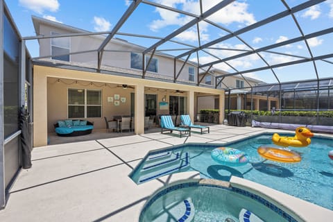 Pool with screen with lanai, seating for 16, string lights, fans 