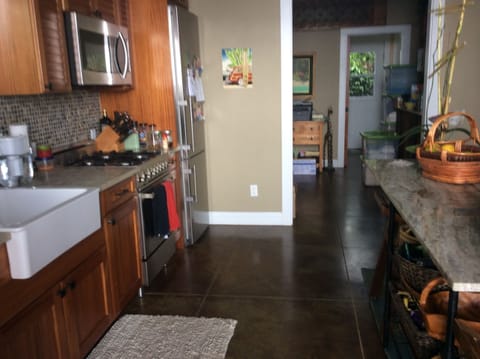 Kitchen in the main cottage with the stove, full refrigerator, and dishwasher.