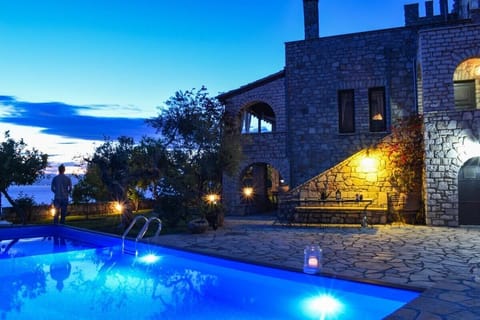 Admire the property's exterior bathed in the soft glow of evening lights