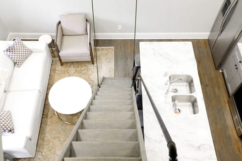 Retractable staircase leading to loft.