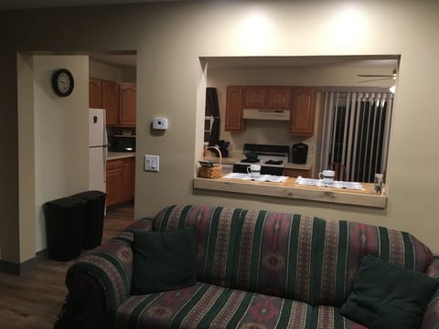 View from the living room through the breakfast nook into the full size kitchen 