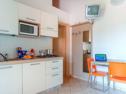 Property, Room, Orange, Building, Furniture, Yellow, Kitchen, Interior Design, Cabinetry, House