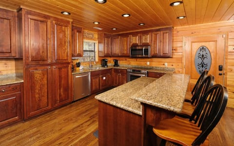 Classic cabin kitchen charm with modern amenities, ready for family feasts.