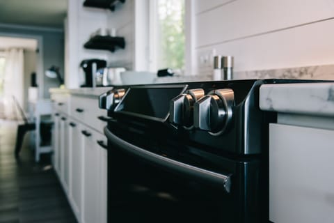 Spacious kitchen with plenty of prep space, oven, microwave, dishwasher & more.