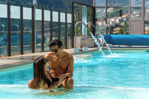 Seasonal outdoor pool, open 10:00 AM to 7:00 PM, sun loungers
