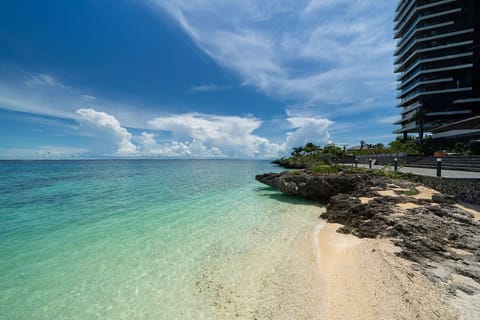 Private beach, white sand, sun loungers, beach umbrellas