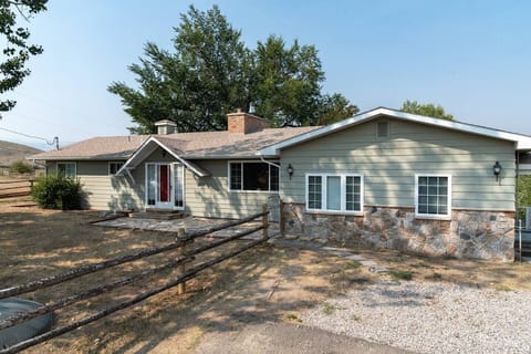 Wind River Place with room for parking for 3 cars on the driveway on the left.  