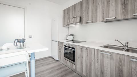 Apartment, 1 Bedroom | Private kitchen | Full-size fridge, oven, stovetop, cookware/dishes/utensils