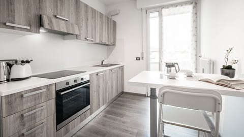 Apartment, 1 Bedroom | Private kitchen | Full-size fridge, oven, stovetop, cookware/dishes/utensils