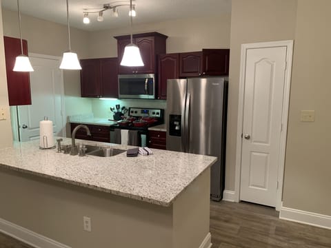 Kitchen with stainless steel appliances .