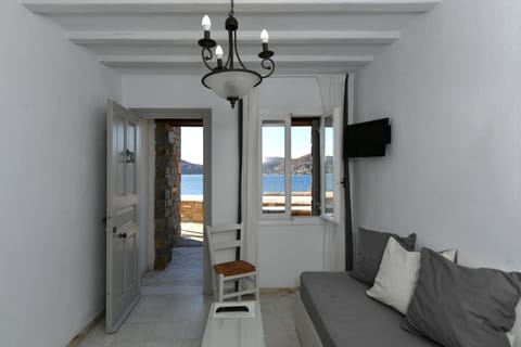 Standard Suite, Sea View | Living area | Flat-screen TV