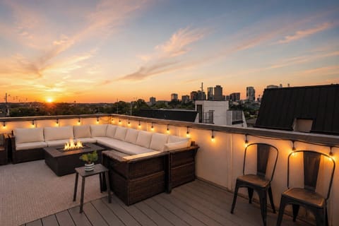 Watch the sun dip behind the skyline from your rooftop fire pit lounge - Cozy seating, twinkle lights, and stunning views, this is the spot everyone talks about - Perfect for wine nights, late laughs, and sky gazing sessions with friends