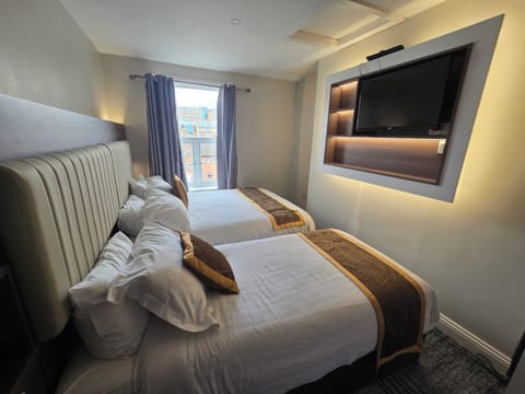 Pillowtop beds, desk, free WiFi, bed sheets