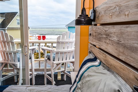 Master bedroom patio with seating to enjoy morning coffee with ocean views