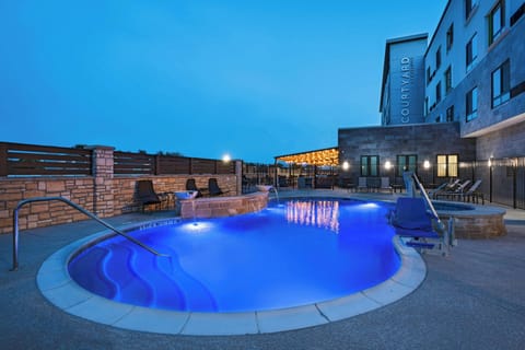Outdoor pool, open 7:00 AM to 10:00 PM, pool umbrellas, sun loungers