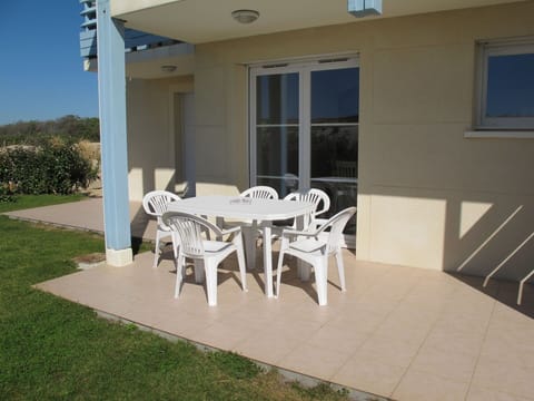 Furniture, Plant, Window, Building, Table, Chair, Interior Design, Outdoor Table, Shade, Outdoor Furniture