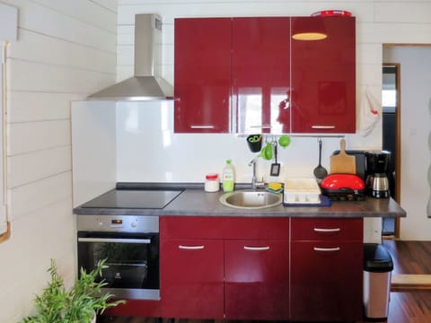 Countertop, Kitchen, Cabinetry, Room, Property, Furniture, Red, Kitchen Stove, Interior Design, House