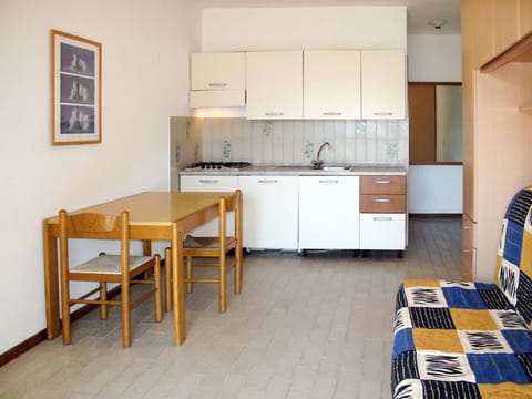 Room, Furniture, Property, Kitchen, Building, Floor, Interior Design, Yellow, Cabinetry, Countertop