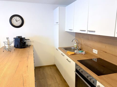 Countertop, Kitchen, Furniture, Cabinetry, Flooring, Interior Design, Kitchen Appliance, Floor, Wood, Major Appliance