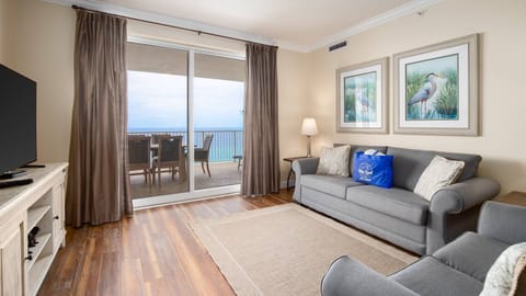 Living room with sleeper sofa and access to balcony