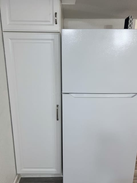 Full sized fridge/freezer and pantry for long term guest.