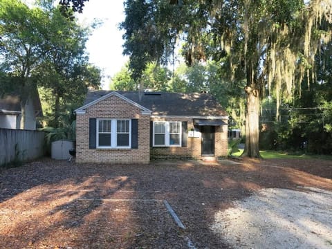 Back of house and parking area/Also entrance to the house through this door.
