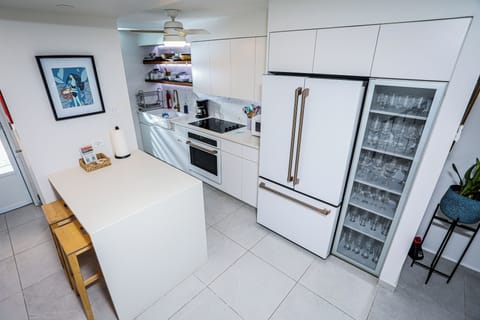 Sleek design with high-end appliances, ideal for guests who love cooking.