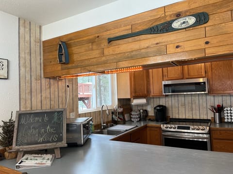 Open concept kitchen looking onto dining and living room