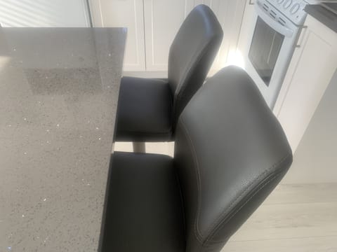 A LOVELY WORK STATION ON YOUR LARGE KITCHEN ISLAND WITH LEATHER, SWIVEL CHAIRS! 